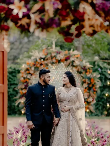 A grand entrance for the couple. I designed these large doors to open up to a stunning floral arch, creating a dramatic and memorable start to their wedding celebration.