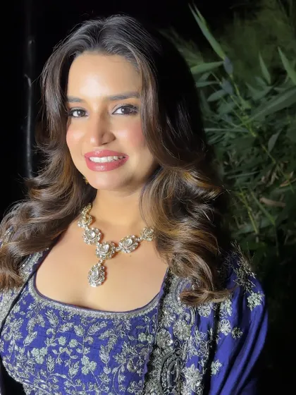A beautiful portrait showing off her radiant smile and the soft, glamorous makeup.