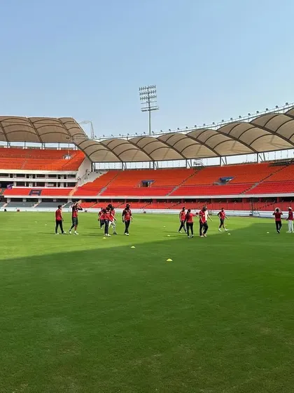 The team goes through its drills under the bright sun.