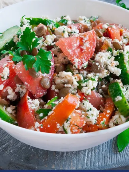 A refreshing summer salad with tomatoes, cucumber, and crumbled paneer. Salads are a great way to stay hydrated and get a variety of vitamins and minerals in one bowl.