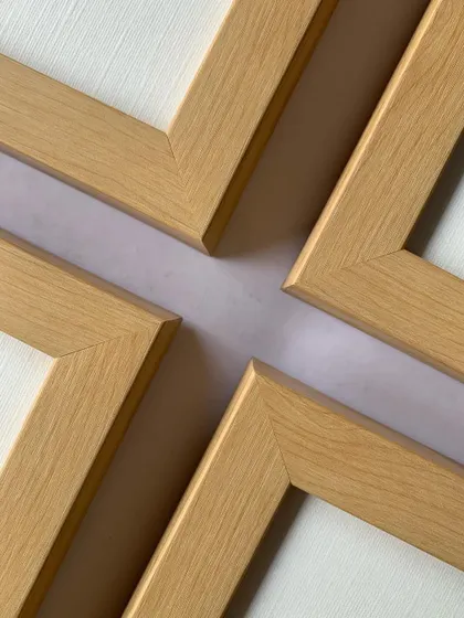 The mitered corners of our elegant maple frames meet perfectly, a testament to the precision and quality we bring to every piece we frame.
