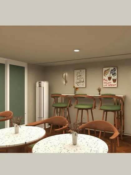 This seating nook offers a more casual cafe-style experience, with terrazzo-topped tables and wooden chairs. The wall decor and lighting are kept simple to create a relaxed and comfortable spot for customers.