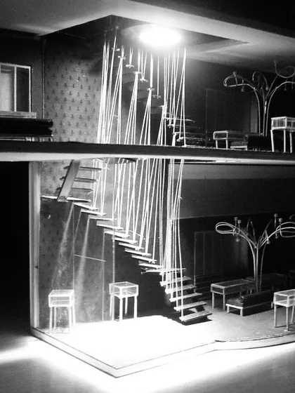 This physical model shows our early concept for the ORRA store, featuring a dramatic staircase suspended by thin cables. We have always used physical models to explore spatial ideas and materiality long before the digital age.