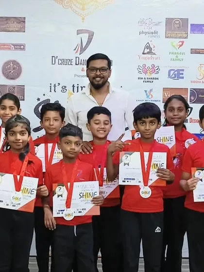 A group of our student performers proudly showing off their medals and certificates.