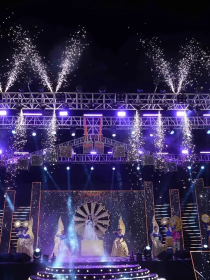 A bride's grand entry for her Sangeet performance, framed by cold pyrotechnics. I design every entry to be a showstopper.