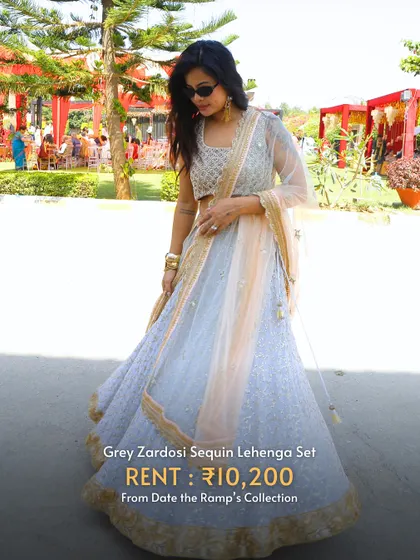 A grey zardosi sequin lehenga set, offering a unique pastel hue for a summer wedding.