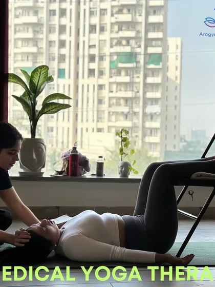 This is a medical yoga therapy session focused on relaxation. Using a chair and gentle hands-on assistance, we guide the student into a state of deep rest, which is essential for healing from stress-related conditions.