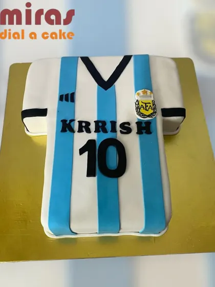 A cake for an Argentina football fan, shaped perfectly like the team's iconic blue and white striped jersey. It's a great way to show team pride on a birthday.