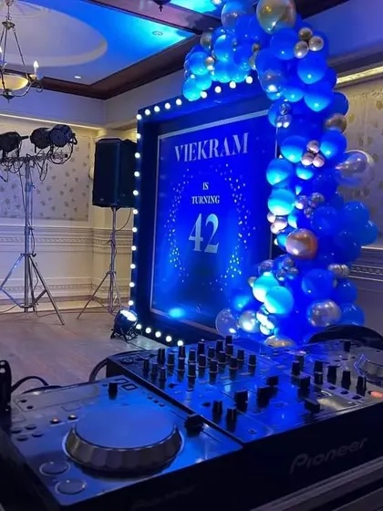 A glimpse of the party atmosphere we can create. This setup for a 42nd birthday includes a DJ console, professional speakers, and lighting, ready for a night of music and dancing.