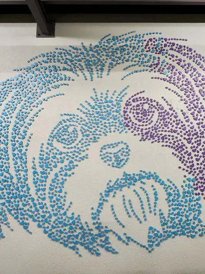 A close-up of the dog portrait at Chasing Tails. You can see how the individual MDF pieces come together to create shading and form, resulting in a highly textured and unique piece of wall art.