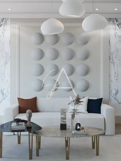 A closer look at the textured wall art and modern coffee tables. The combination of different shapes, materials, and textures adds depth and sophistication to the living space.