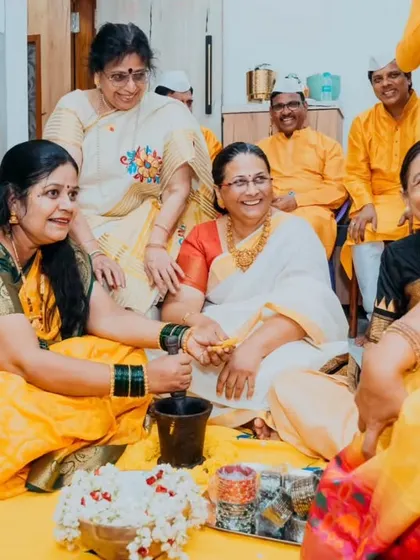 The women of the family gathered together, performing rituals and sharing laughter during the groom's Haldi ceremony.