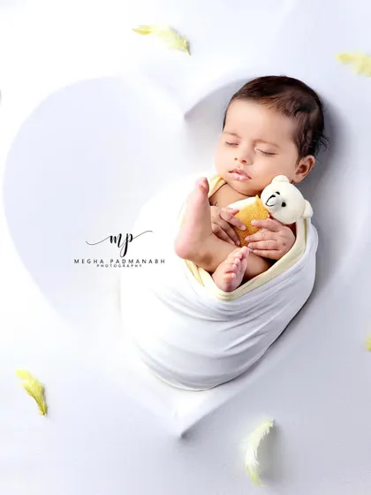 A top-down view of the baby and bear, creating a perfect heart-shaped frame.