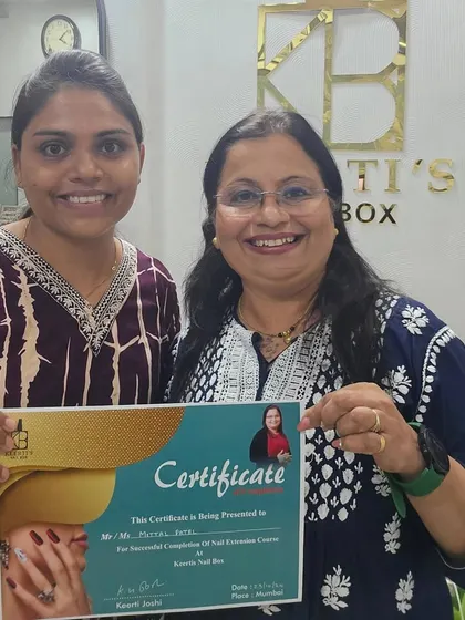 Another happy student, Mittal, receiving her certificate. It's incredibly rewarding to see students complete the course, ready to start their own entrepreneurial journey.