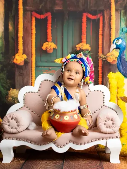 This baby boy, dressed as Krishna, is all smiles as he holds his pot of butter. The joy in these sessions is contagious.