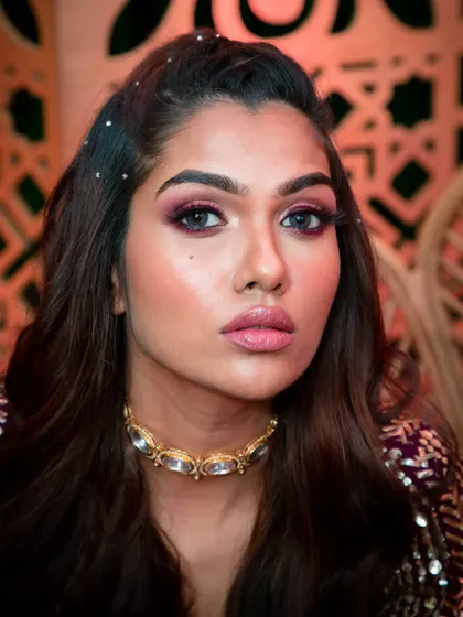 When the event calls for full-on glamour, I love to play with rich colours. This look features a dramatic smokey eye with deep berry tones and glowing skin, perfect for a sangeet or reception against a glittering backdrop.