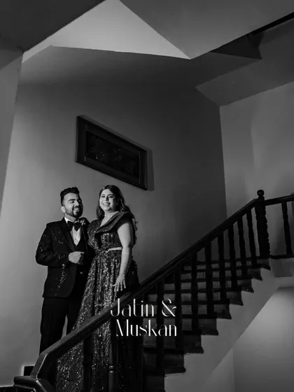 A classic black and white portrait of Jatin and Muskan on the staircase. This elegant and timeless shot adds a touch of old-world glamour to their Sangeet album.