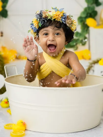 A big, happy shout! This little one is loving every second of her first birthday photoshoot experience.