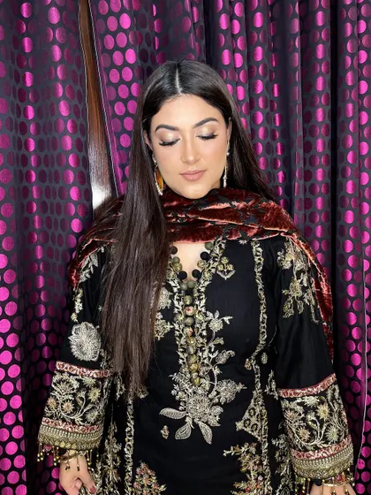 The complete look is a perfect fusion of traditional attire and modern, subtle glam makeup.