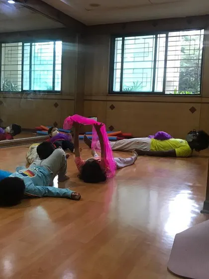 A look at our outdoor program, where we bring "Serious Fun" right to your apartment's doorstep. These images show kids enjoying gymnastics and yoga on mats in both indoor and outdoor community spaces.