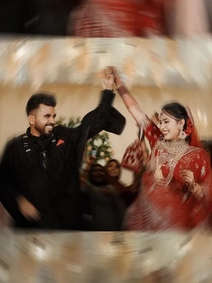 A whirlwind of happiness on the dance floor. This shot captures the dynamic energy and pure joy of the couple's first dance as husband and wife.