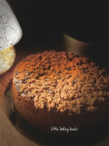A side view of the banana-coconut-lime cake, showing off the thick, generous layer of streusel topping.