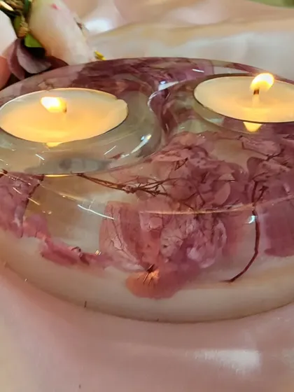 Another view of the pink and white floral tealight holder. The yin-yang shape is perfect for creating a sense of balance and harmony in your decor.