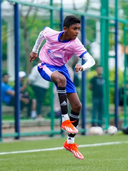 A player leaps into the air during a dynamic warm-up. We ensure our players are physically prepared for every session.
