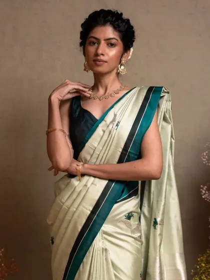 A closer look at the elegant drape of the Banarasi kathan silk, a fabric known for its softness and richness.