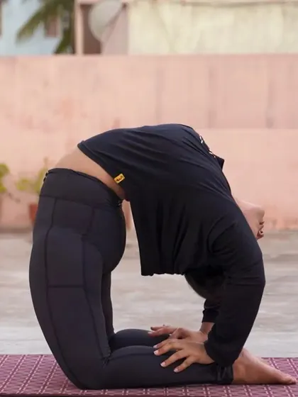 Working towards Kapotasana, or Pigeon Pose. This is a deep backbend that requires open shoulders and hip flexors. I guide students through preparatory poses to make advanced postures like this more accessible.