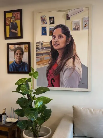 The final destination for my art. This large-scale custom acrylic portrait is shown hanging in my client's living room, demonstrating how a painting can transform a space.