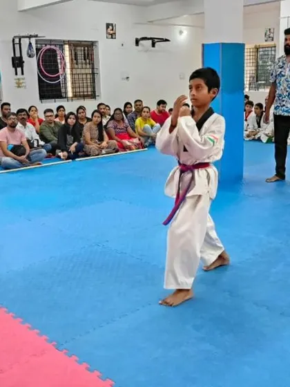 A student executes a kick as part of his Poomsae.