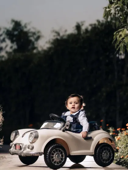 A stylish little driver in her vintage convertible. I love using these ride-on car props to create fun, imaginative portraits for toddlers.