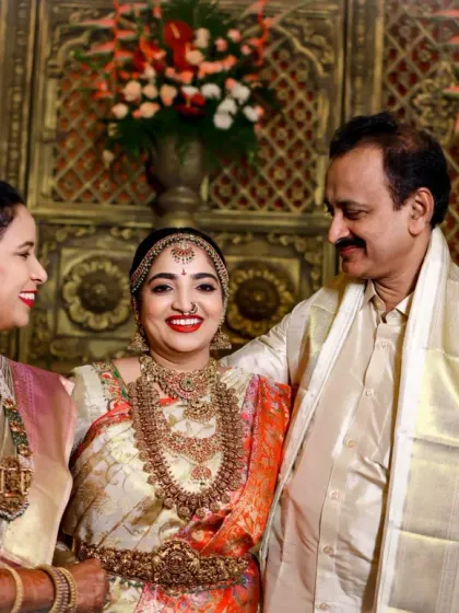 A beautiful portrait of the bride with her parents. This photo captures the pride and happiness of the family on this momentous occasion.