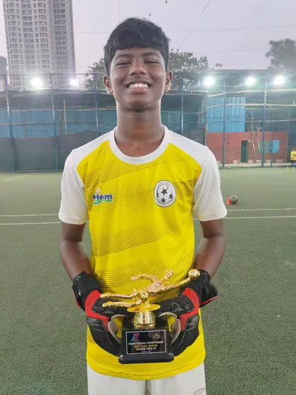 Kayden Vaz proudly displays his award for Best Emerging Player. We are excited to see him continue to grow and develop his skills.