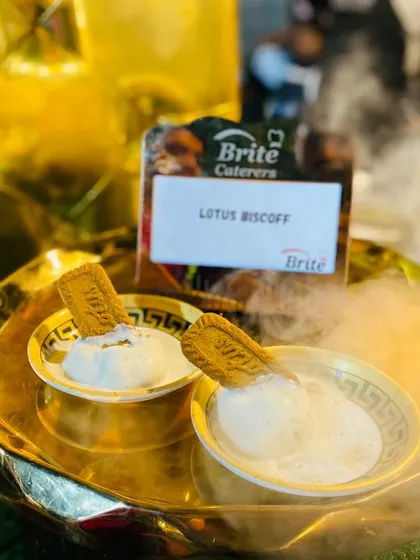 Lotus Biscoff ice cream served with a dramatic dry ice effect, adding a touch of theater to the dessert course.