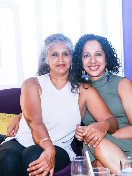 Two friends enjoying the evening, taking a break from dancing. Our socials are a great way to catch up and have fun.