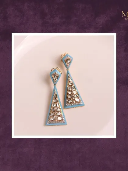 Elevate your style with these stunning geometric earrings. The triangular shape, light blue enamel, and sparkling Polki diamonds create a look that is elegant and contemporary.
