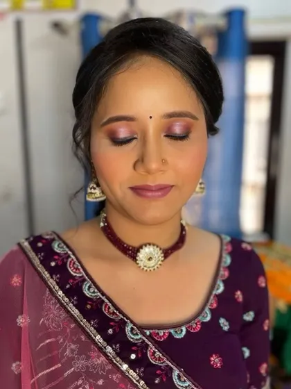A close-up of the eye makeup, showing the beautiful blend of shimmery pink and purple eyeshadows.