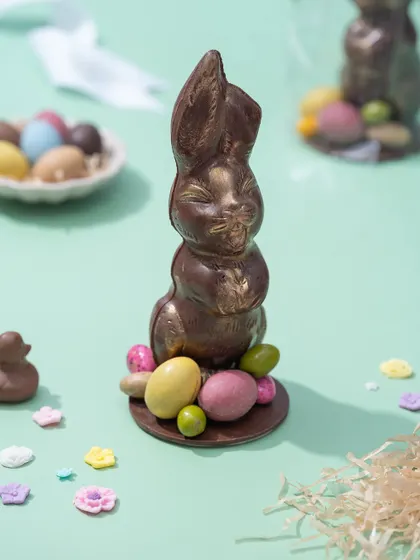 Another view of the handcrafted chocolate bunny, showing the subtle gold dusting that gives it a luxurious finish.