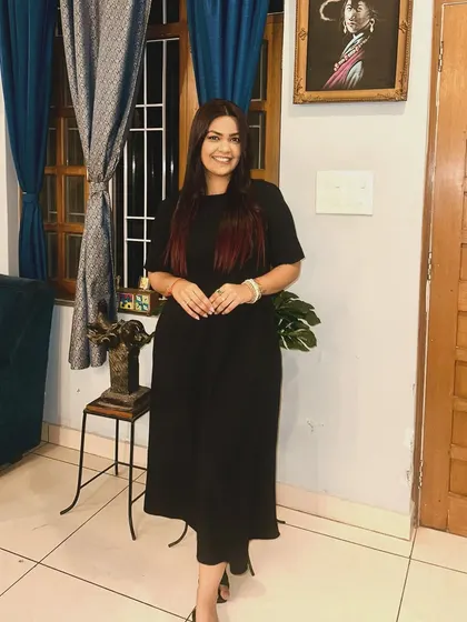 A classic all-black jumpsuit. The simplicity of the silhouette makes it incredibly versatile and elegant.