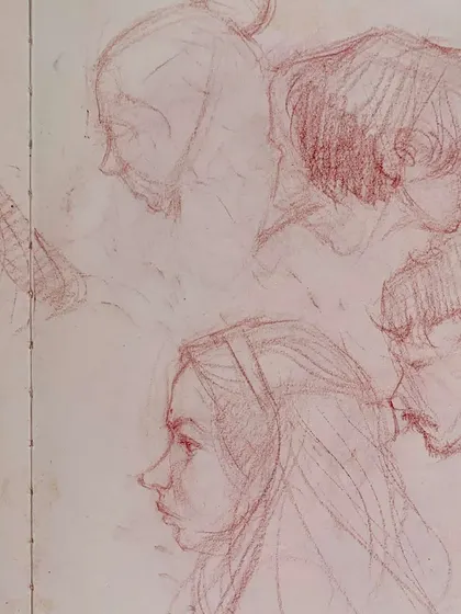A page of delicate, classical-style portrait sketches in red pencil, capturing the faces of the festival.