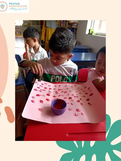The color tablets are a classic Montessori sensorial material. Here, a child is using stamps to explore color, refining his visual perception and learning to discriminate between different shades.