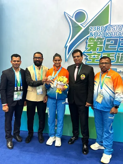 The support team behind a champion. Here we are with silver medalist Ms. Rusha Tambat at the Asian Karate Championship. Our national coaches and officials provide constant guidance and support during major competitions.