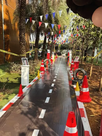 The party entrance sets the stage for an epic race. This custom walkway was designed to look like a real road, complete with traffic cones and caution tape.