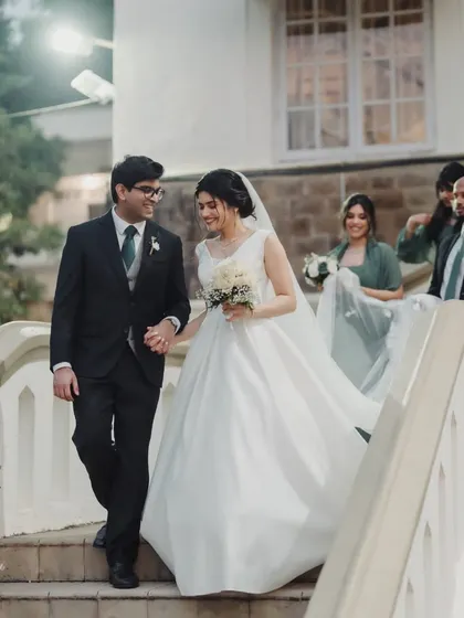 The grand exit from the church. This couple looks so happy and in love, and her classic bridal look is perfect for the moment.