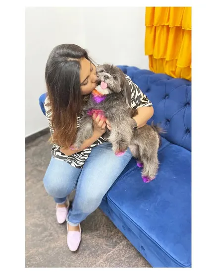A sweet kiss from my own dog, Sage. The love we share inspires the gentle approach I bring to every grooming session.