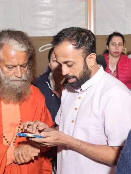 A personal moment of interaction and learning with a revered Swami during our spiritual journey to the Kumbh Mela.