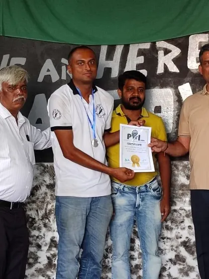 A student receiving his certificate and medal at an awards ceremony. We believe in formally recognizing the dedication and success of our members to encourage their continued growth.