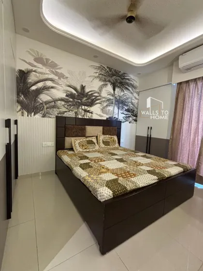 This bedroom features a striking tropical-themed wallpaper behind the bed, creating a resort-like feel. The dark wood bed and two-tone wardrobe complete the modern, aesthetic look.